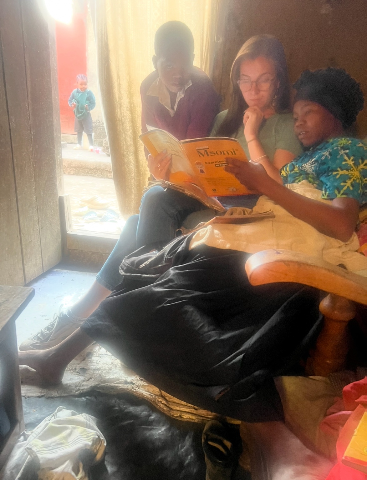 A child reading from an open book.